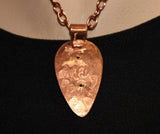 handcrafted copper teardrop pendant with turquoise center bead on copper chain