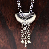 sterling shell shaped pendant with heart dangles on silver chain
