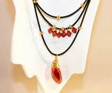 red magma swarovski pendant and crystals on black leather necklace
