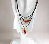 red magma swarovski pendant and crystals on black leather necklace