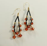 red magma swarovski crystals and black leather gold filled earrings