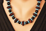 turquoise with sono wood and black onyx on leather cord necklace