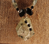 prehnite faceted trapezoid pendant and oval beads, black onyx and sterling necklace