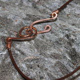 copper pendant with copper and turquoise beads on leather cord