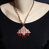 embossed copper pendant and south american topaz beads on copper chain and leather cord
