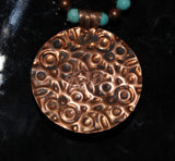 embossed copper pendant necklace with turquoise cab and turquoise coral fossil beads