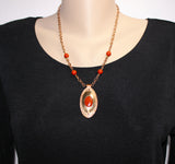handcrafted solid bronze and copper pendant with red jasper cabochon on bronze chain