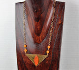 bronze triangular pendant with tangerine sea glass and beads