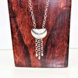 sterling shell shaped pendant with heart dangles on silver chain